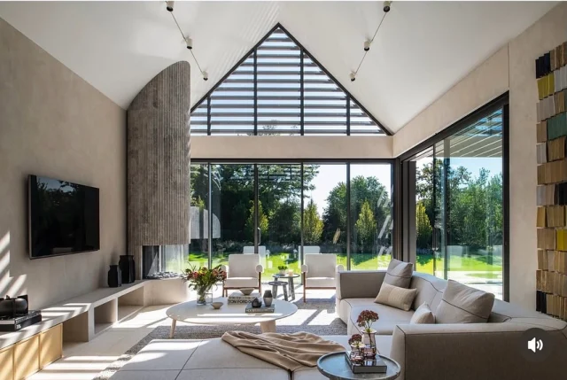 This pool house living room was designed to feel just as inviting in summer as it does in winter. Floor-to-ceiling windows pull in the landscape and flood the space with natural light, while a sculptural fireplace anchors the room when temperatures drop. A space built for gathering, reflection, and year-round living.
Ready for a cozier season?

Builder: @sbphomes
Interior Design: @nimadesigninteriors
Architect: @c_ohlabstudio
Photography: @macchiaphoto
Featured in @cottagesgardens 

#sbphomes #luxuryhomebuilder #cozyinteriors #cottagesandgardens #homeinspiration